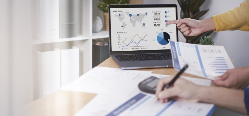 businesspeople meeting plan analysis graph company finance strat thiết kế web Halo Media